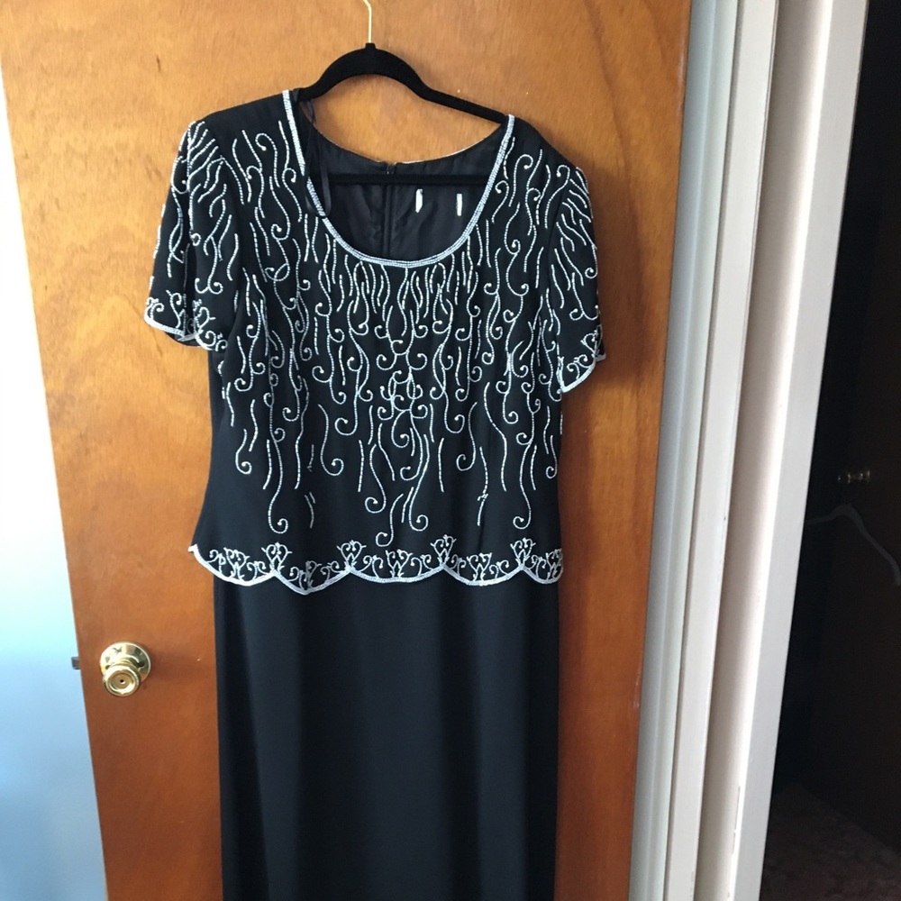 Black full length gown.  The top front is beaded.
